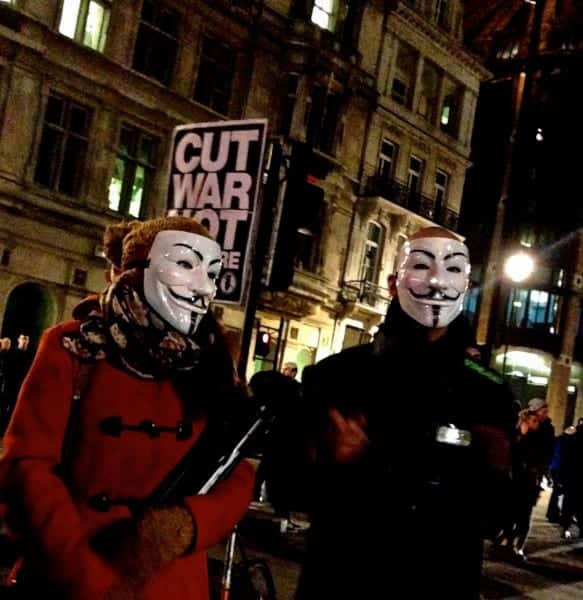 Protestors in masks gather at near Parliament on Nov. 5, 2013